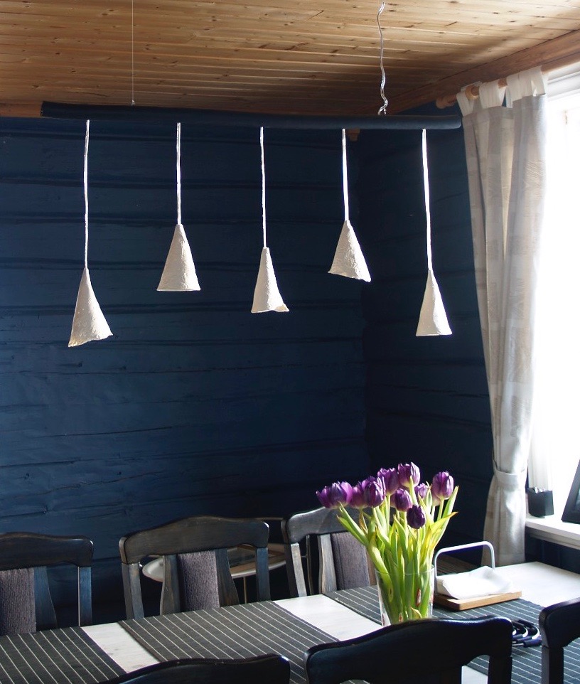 Group of cone pendants above a dining table