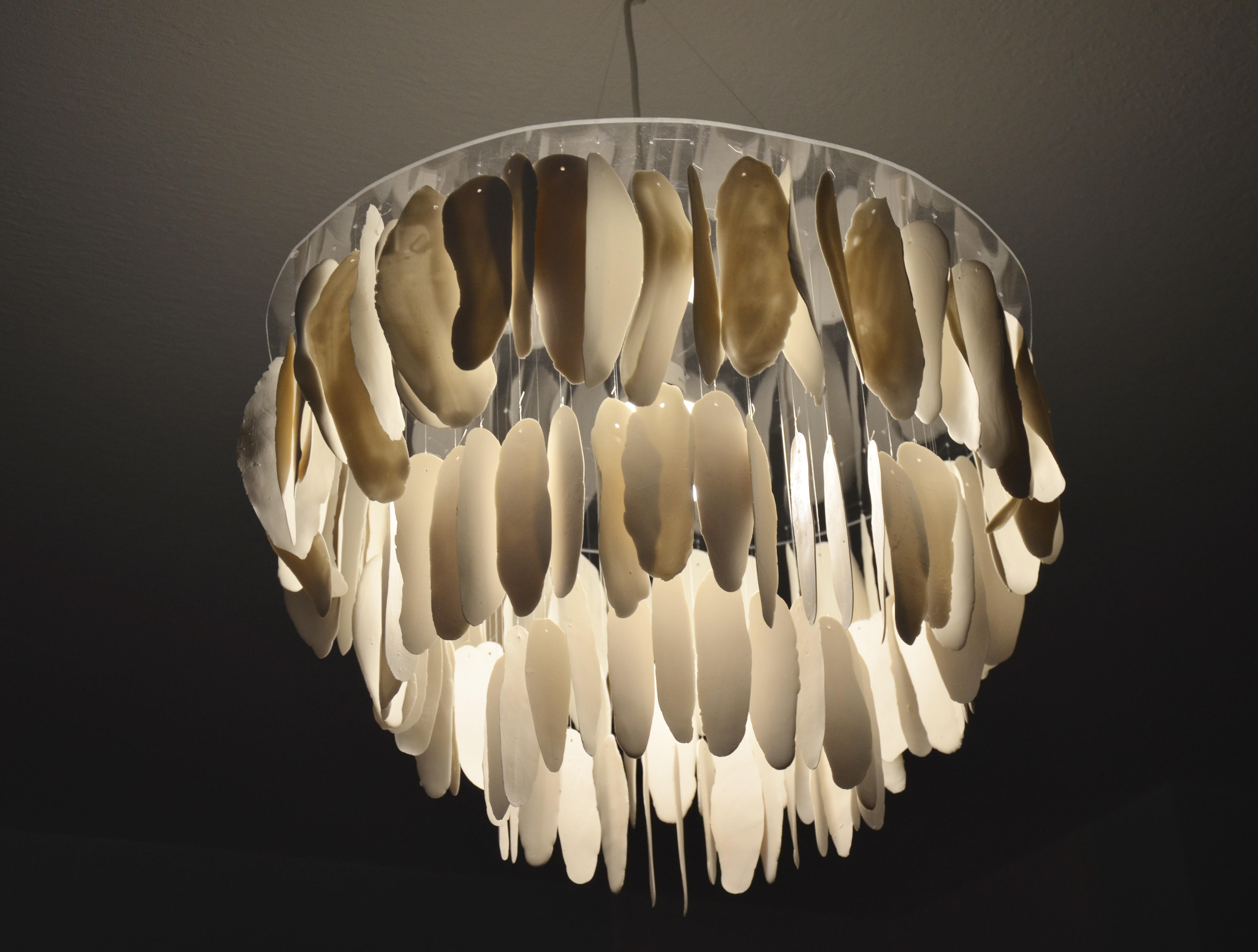 Chandelier made of tranclucent porcelain feathers
