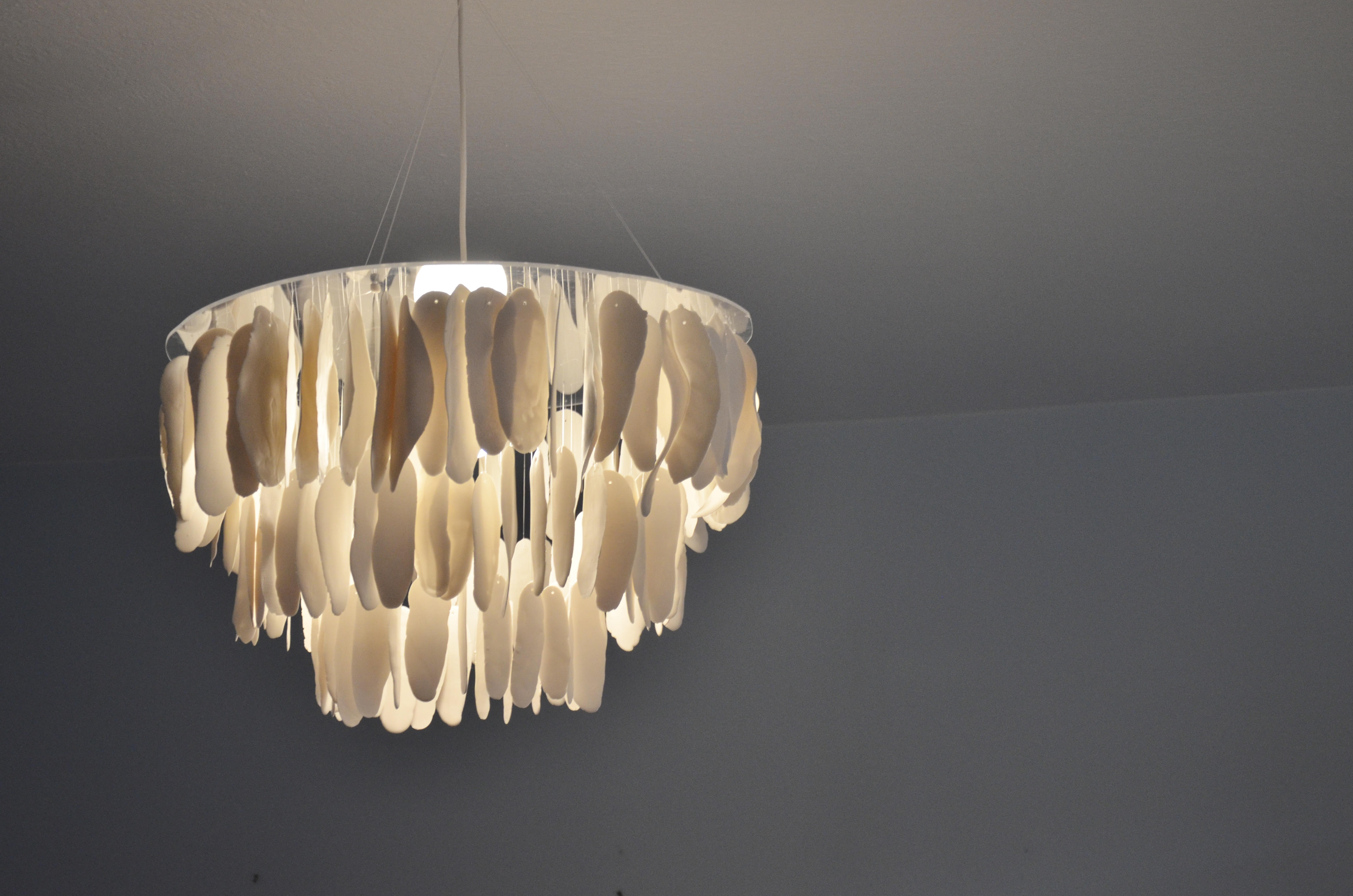 Chandelier made of tranclucent porcelain feathers