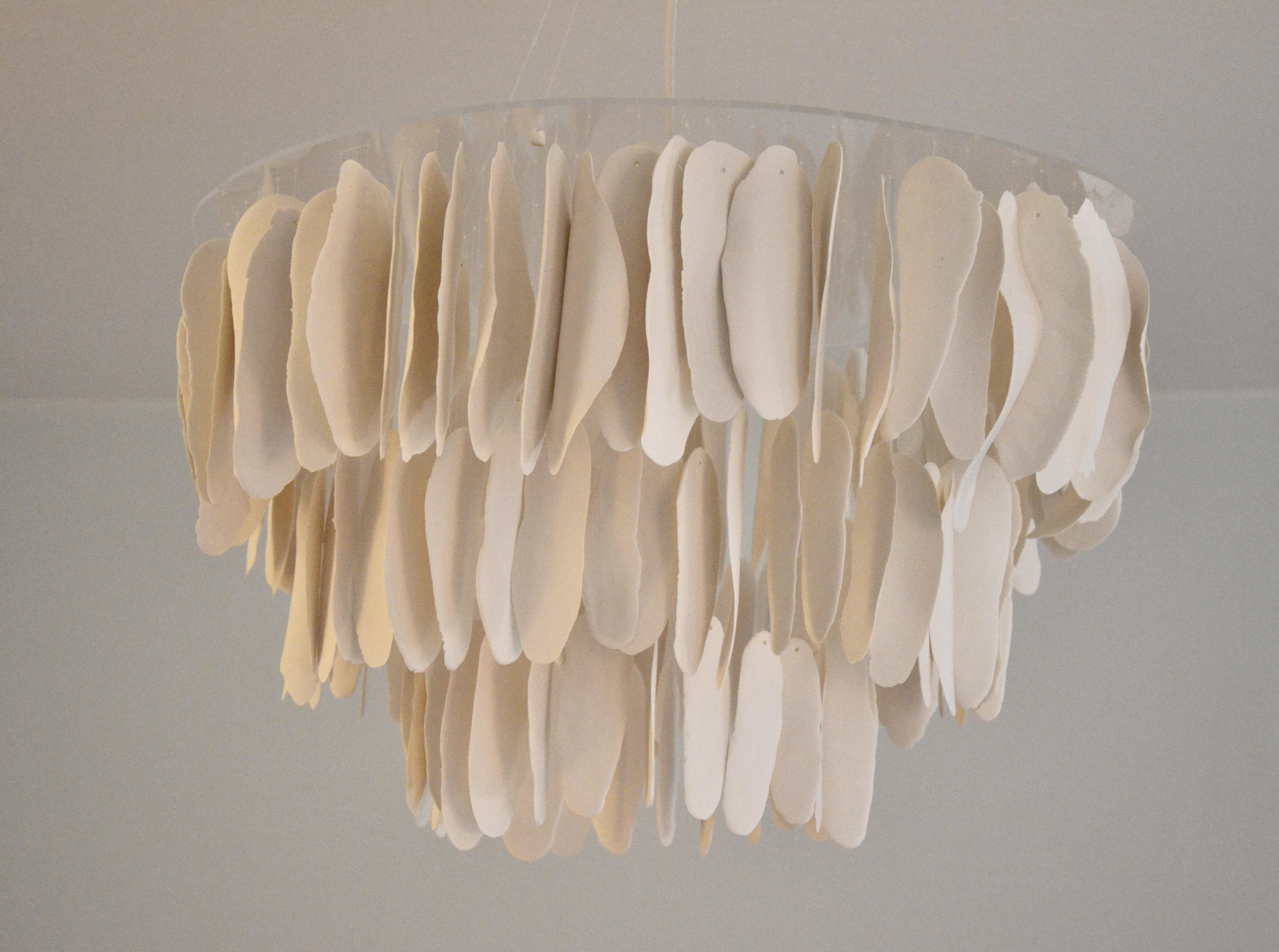 Chandelier made of tranclucent porcelain feathers