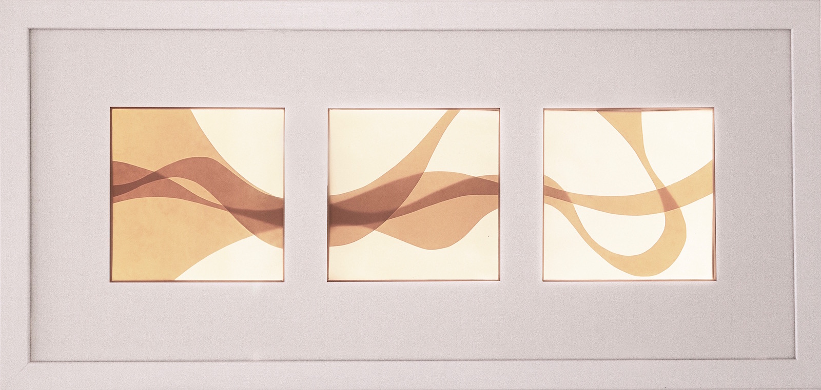Backlit image consisting of three windows with abstract wave shapes spanning across