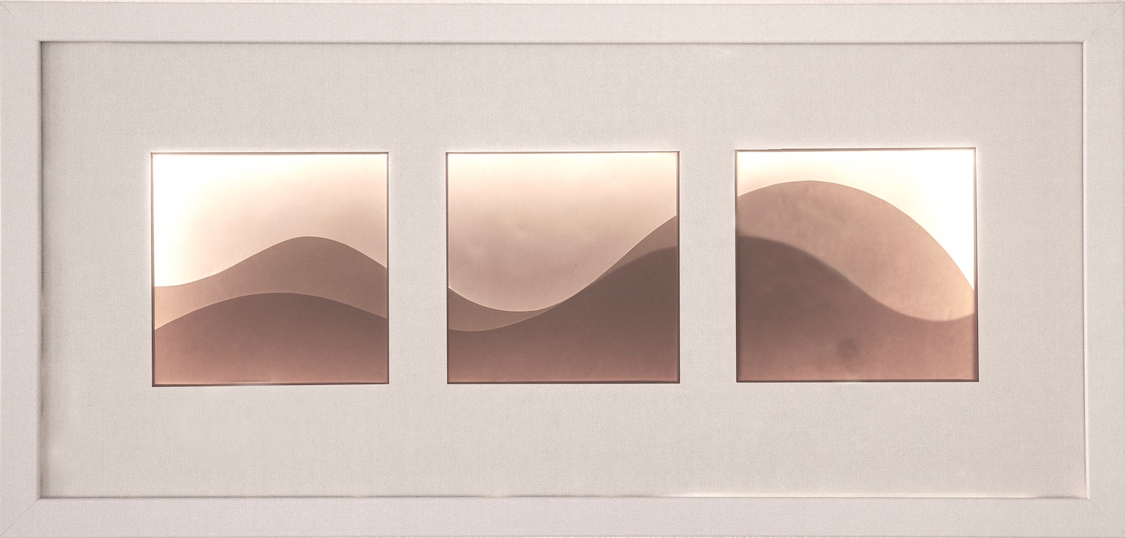 Backlit image consisting of three windows with abstract wave shapes spanning across